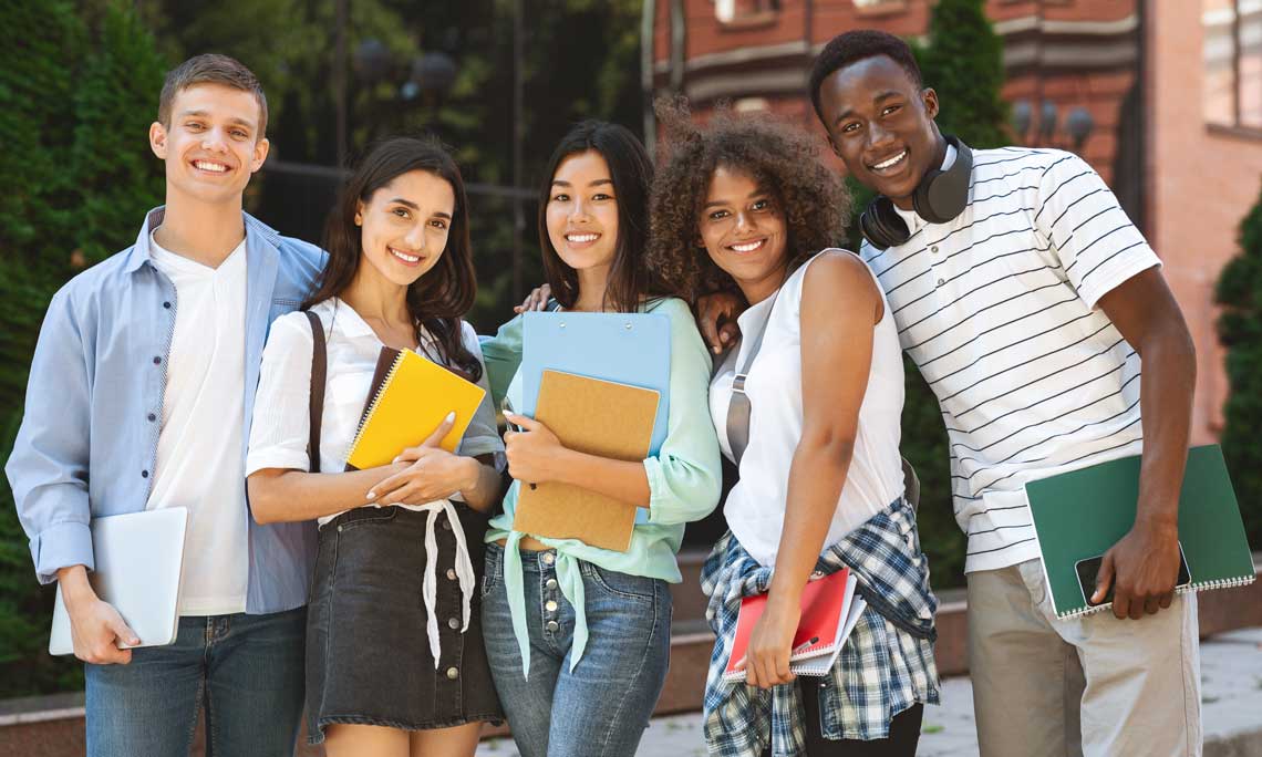 Diverse group of students standing outside